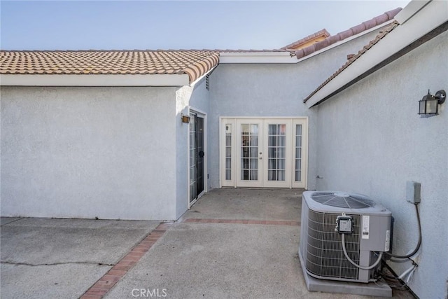 14079 El Camino Pl, Fontana, CA 92337 - view of patio featuring french doors and central AC unit