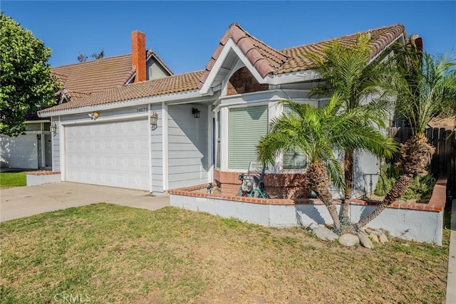 14079 El Camino Pl, Fontana, CA 92337 - view of front of property with a tiled roof, a garage, a front lawn, concrete driveway, and a chimney