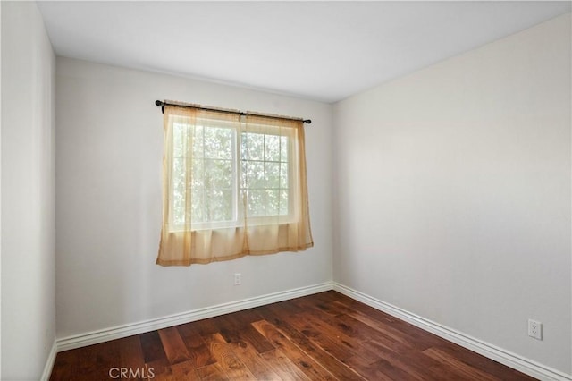 61 Bridgeport, Irvine, CA 92620 - spare room featuring dark wood-style floors and baseboards
