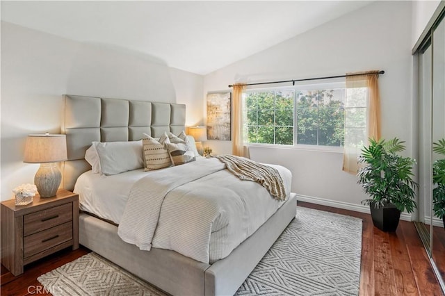 61 Bridgeport, Irvine, CA 92620 - bedroom with vaulted ceiling, wood-type flooring, and baseboards