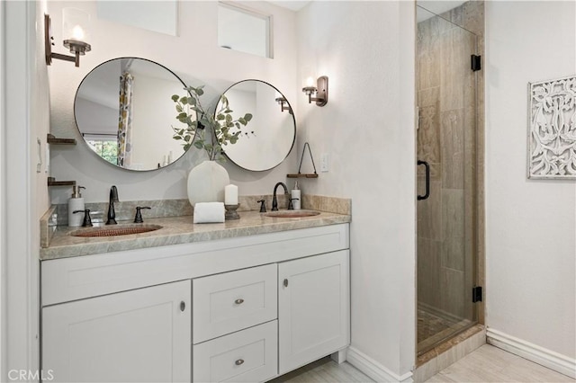 61 Bridgeport, Irvine, CA 92620 - full bathroom with a stall shower, double vanity, and baseboards