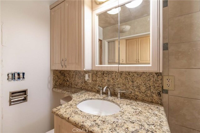 600 Moreno Ln, Sugarloaf, CA 92386 - bathroom featuring vanity and decorative backsplash