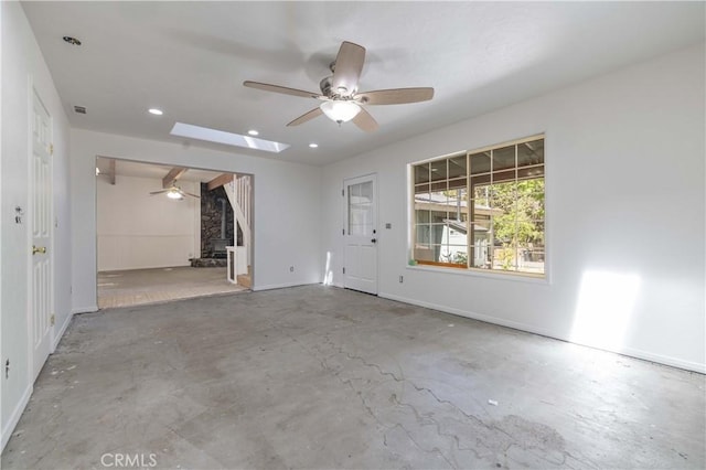 600 Moreno Ln, Sugarloaf, CA 92386 - unfurnished room featuring a ceiling fan, concrete floors, recessed lighting, baseboards, and a skylight