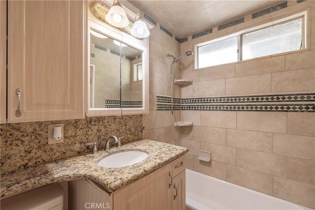 600 Moreno Ln, Sugarloaf, CA 92386 - bathroom with bathing tub / shower combination, vanity, backsplash, and toilet