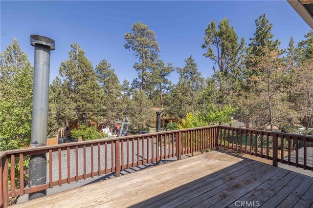 600 Moreno Ln, Sugarloaf, CA 92386 - wooden deck featuring view of wooded area