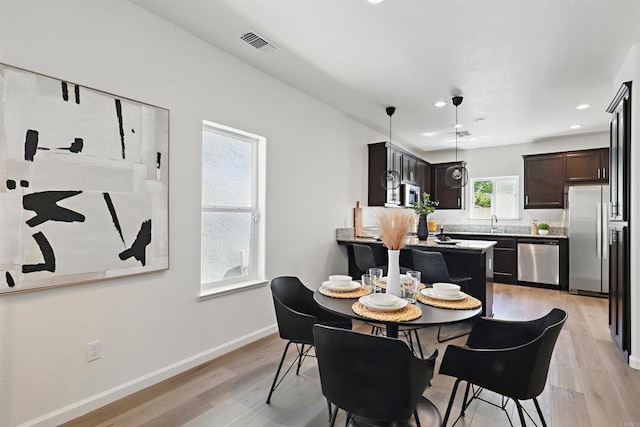 170 Montage Dr, Merced, CA 95348 - dining area with light wood finished floors, baseboards, and recessed lighting