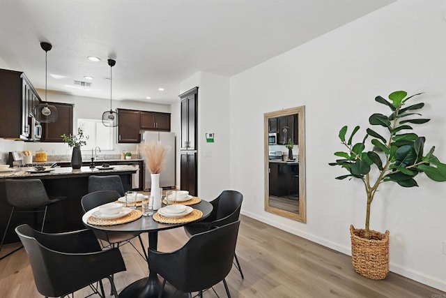170 Montage Dr, Merced, CA 95348 - dining area featuring light wood-style flooring, baseboards, and recessed lighting