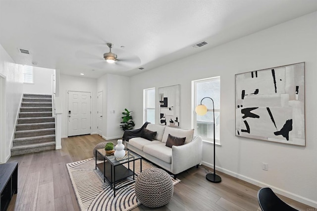 170 Montage Dr, Merced, CA 95348 - living area featuring baseboards, stairway, and light wood-style flooring