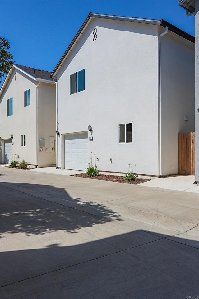 170 Montage Dr, Merced, CA 95348 - view of property exterior featuring an attached garage, stucco siding, and concrete driveway