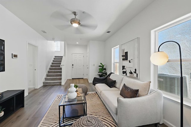 170 Montage Dr, Merced, CA 95348 - living room featuring stairway, wood finished floors, ceiling fan, and baseboards