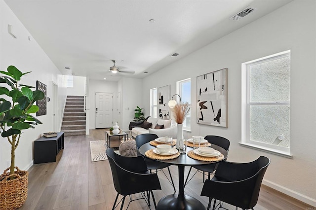 170 Montage Dr, Merced, CA 95348 - dining room with stairway, ceiling fan, baseboards, and light wood-type flooring