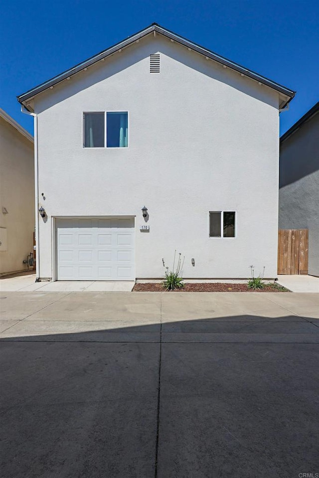 170 Montage Dr, Merced, CA 95348 - view of side of home with driveway, stucco siding, and a garage