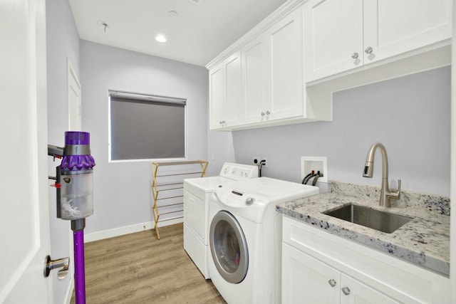 25034 Poderio Dr, Ramona, CA 92065 - laundry area featuring washing machine and clothes dryer, cabinet space, light wood-style flooring, baseboards, and recessed lighting