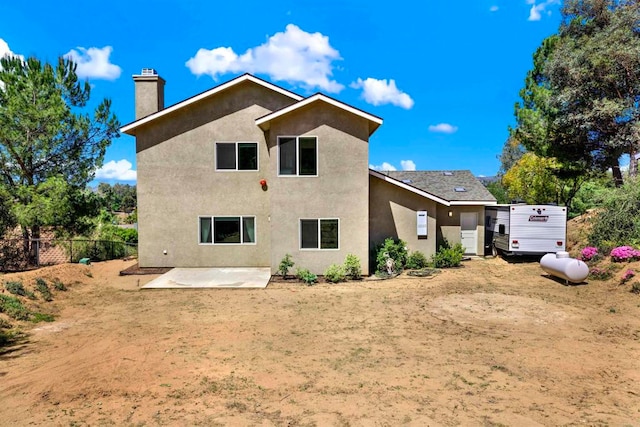 25034 Poderio Dr, Ramona, CA 92065 - back of property featuring a patio, a chimney, and stucco siding