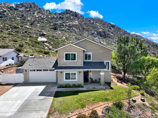 25034 Poderio Dr, Ramona, CA 92065 - traditional-style home with stucco siding, a mountain view, a gate, concrete driveway, and covered porch