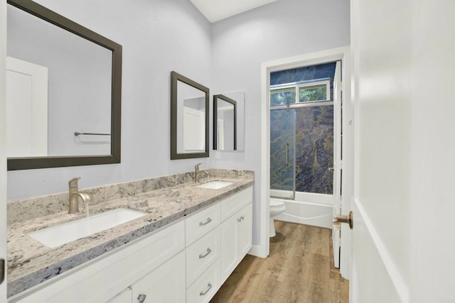 25034 Poderio Dr, Ramona, CA 92065 - bathroom featuring toilet, wood finished floors, double vanity, and shower / tub combination