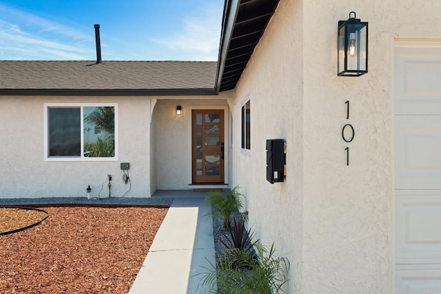 101 Coolwater Dr, San Diego, CA 92114 - property entrance featuring stucco siding, a shingled roof, and a garage