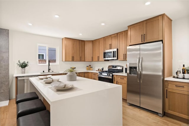 101 Coolwater Dr, San Diego, CA 92114 - kitchen with stainless steel appliances, light wood-style floors, light countertops, and recessed lighting