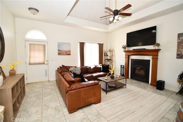 8250 Cataba Rd, Oak Hills, CA 92344 - living room featuring plenty of natural light, a ceiling fan, a fireplace, and light tile patterned floors