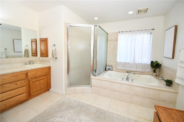 8250 Cataba Rd, Oak Hills, CA 92344 - bathroom with tile patterned flooring, vanity, a shower stall, a garden tub, and recessed lighting