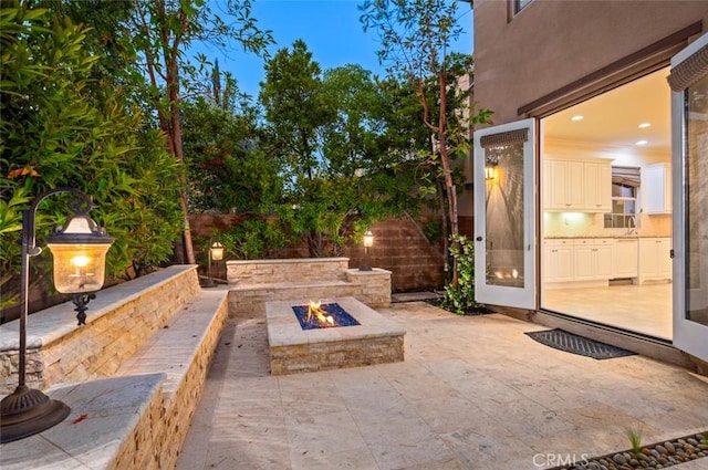 21 Land Bird, Irvine, CA 92618 - view of patio with an outdoor fire pit and a sink