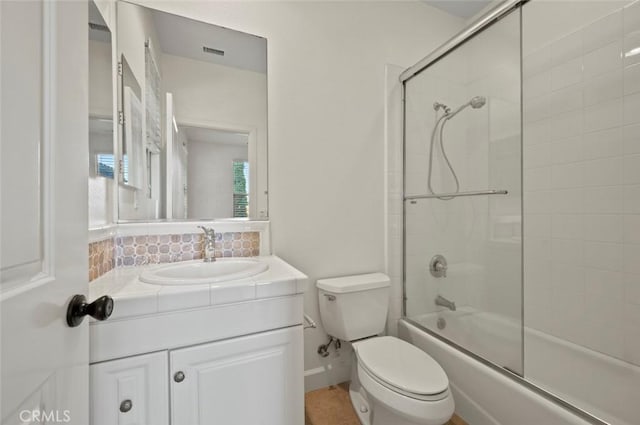 21 Land Bird, Irvine, CA 92618 - full bathroom with toilet, combined bath / shower with glass door, vanity, and decorative backsplash