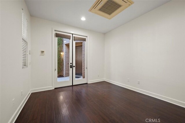 21 Land Bird, Irvine, CA 92618 - empty room with baseboards, dark wood-style flooring, recessed lighting, and french doors