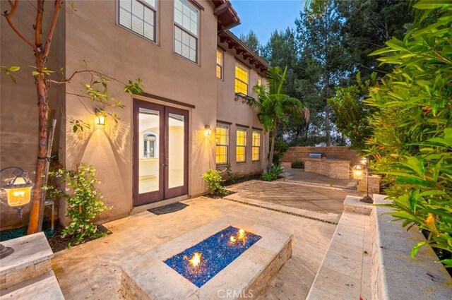 21 Land Bird, Irvine, CA 92618 - view of patio with a fire pit and french doors