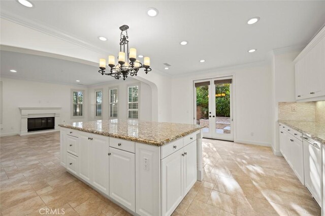 21 Land Bird, Irvine, CA 92618 - kitchen featuring recessed lighting, plenty of natural light, crown molding, a center island, and backsplash