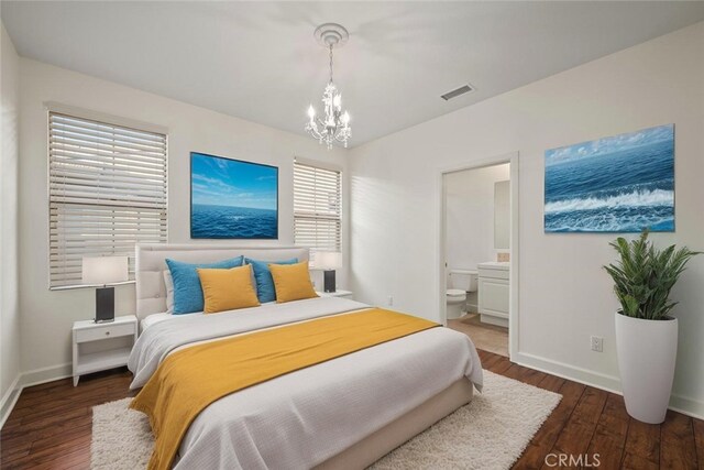 21 Land Bird, Irvine, CA 92618 - bedroom with a chandelier, wood finished floors, baseboards, and ensuite bathroom