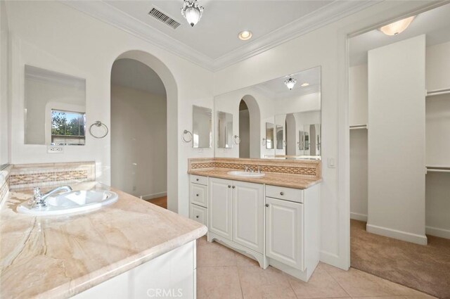 21 Land Bird, Irvine, CA 92618 - full bathroom featuring vanity, crown molding, tile patterned floors, baseboards, and a spacious closet