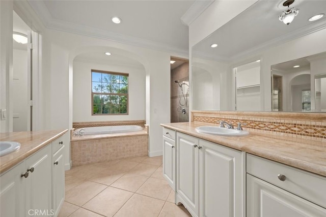 21 Land Bird, Irvine, CA 92618 - full bathroom featuring two vanities, a bath, tile patterned flooring, backsplash, and crown molding