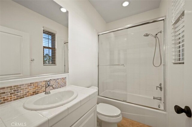 21 Land Bird, Irvine, CA 92618 - full bathroom featuring vanity, toilet, decorative backsplash, enclosed tub / shower combo, and tile patterned floors