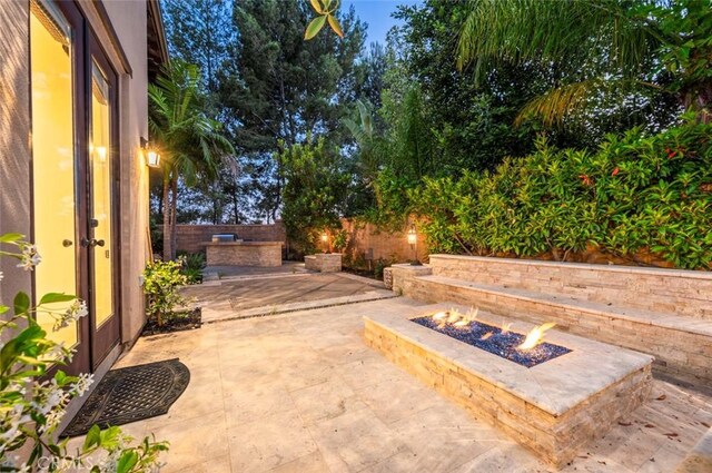 21 Land Bird, Irvine, CA 92618 - view of patio / terrace featuring a fire pit