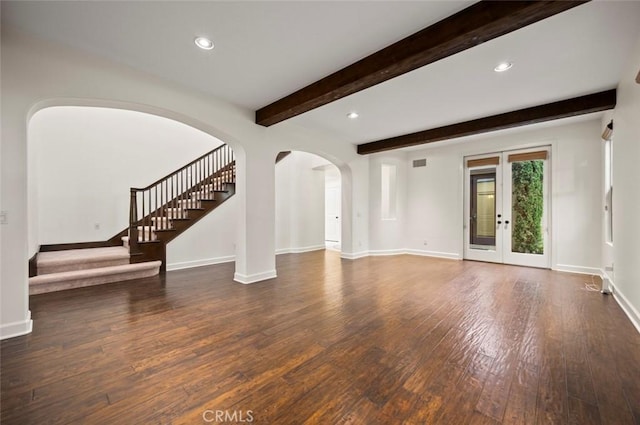 21 Land Bird, Irvine, CA 92618 - unfurnished living room featuring arched walkways, wood finished floors, baseboards, beam ceiling, and recessed lighting