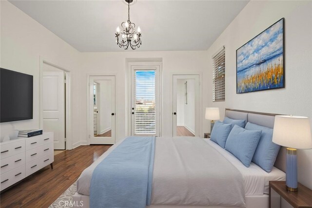 21 Land Bird, Irvine, CA 92618 - bedroom with a chandelier, access to exterior, dark wood finished floors, and baseboards