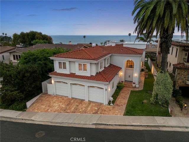 4026 Calle Lisa, San Clemente, CA 92672 - mediterranean / spanish-style home featuring a tiled roof, stucco siding, decorative driveway, and an attached garage