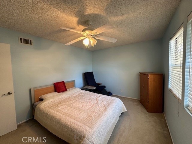 2070 Avenida Placida Unit 3, Simi Valley, CA 93063 - bedroom with carpet flooring, a textured ceiling, a ceiling fan, and baseboards