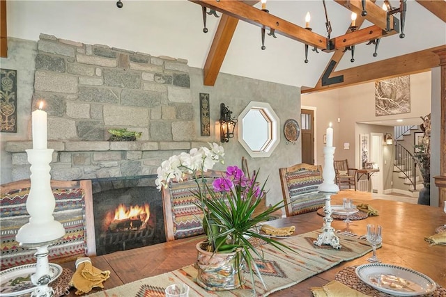 923 Lake Edge Way, Lake Arrowhead, CA 92352 - living room with stairway, high vaulted ceiling, beamed ceiling, and a stone fireplace