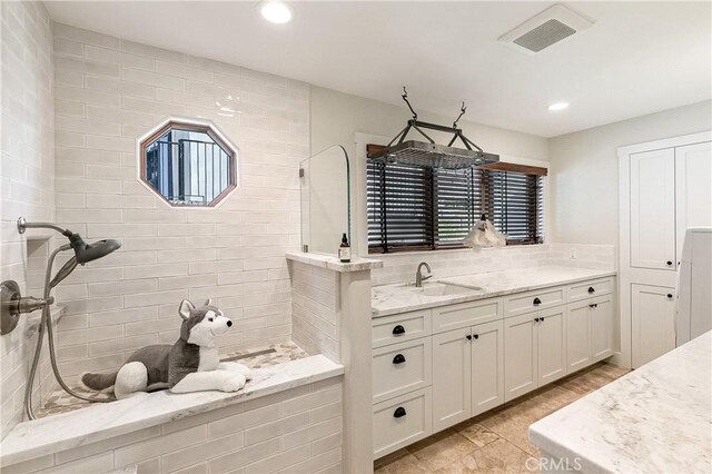 923 Lake Edge Way, Lake Arrowhead, CA 92352 - bathroom with recessed lighting, walk in shower, vanity, and decorative backsplash