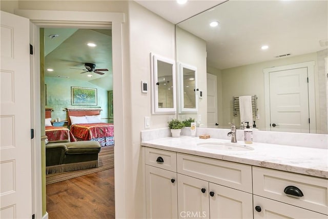 923 Lake Edge Way, Lake Arrowhead, CA 92352 - bathroom featuring wood finished floors, vanity, ceiling fan, ensuite bath, and recessed lighting
