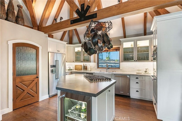 923 Lake Edge Way, Lake Arrowhead, CA 92352 - kitchen with appliances with stainless steel finishes, beverage cooler, backsplash, and dark wood-style floors