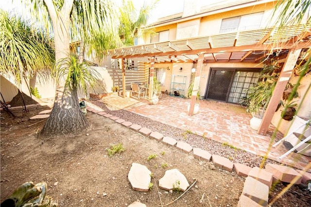 1921 Pine Dr, La Habra, CA 90631 - back of house with a fenced backyard, a patio, a pergola, and stucco siding