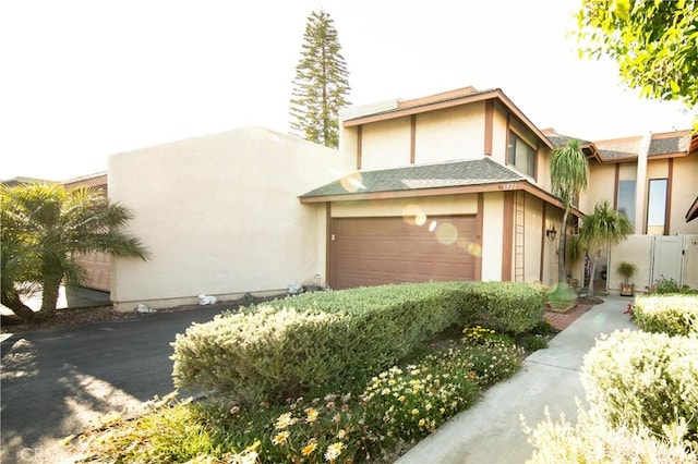 1921 Pine Dr, La Habra, CA 90631 - view of front of home with stucco siding and a garage