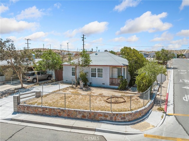 1040 Flora St, Barstow, CA 92311 - ranch-style house with a fenced front yard and stucco siding
