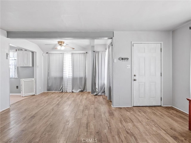 1040 Flora St, Barstow, CA 92311 - unfurnished living room with ceiling fan, light wood-type flooring, and baseboards