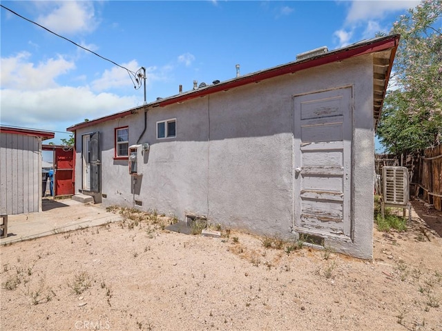 1040 Flora St, Barstow, CA 92311 - back of house featuring stucco siding