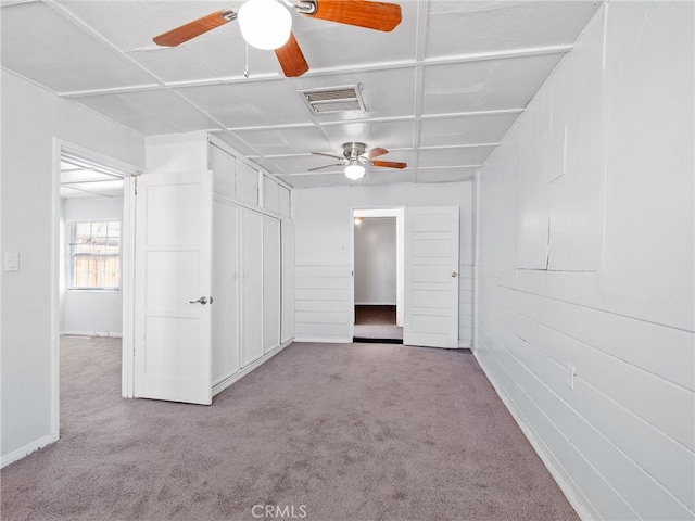 1040 Flora St, Barstow, CA 92311 - unfurnished bedroom with carpet flooring, a closet, ceiling fan, and baseboards