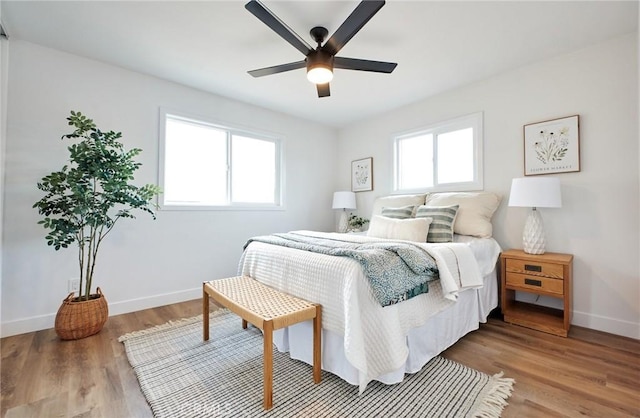 16417 Ivy Ave, Fontana, CA 92335 - bedroom with baseboards, wood finished floors, and a ceiling fan