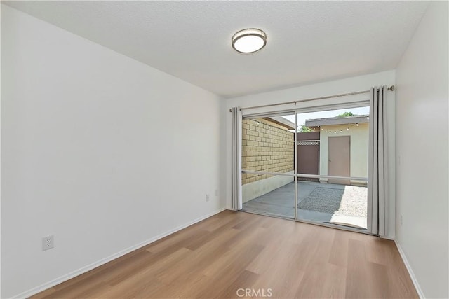 22789 Palm Ave Unit B, Grand Terrace, CA 92313 - empty room featuring wood finished floors and baseboards